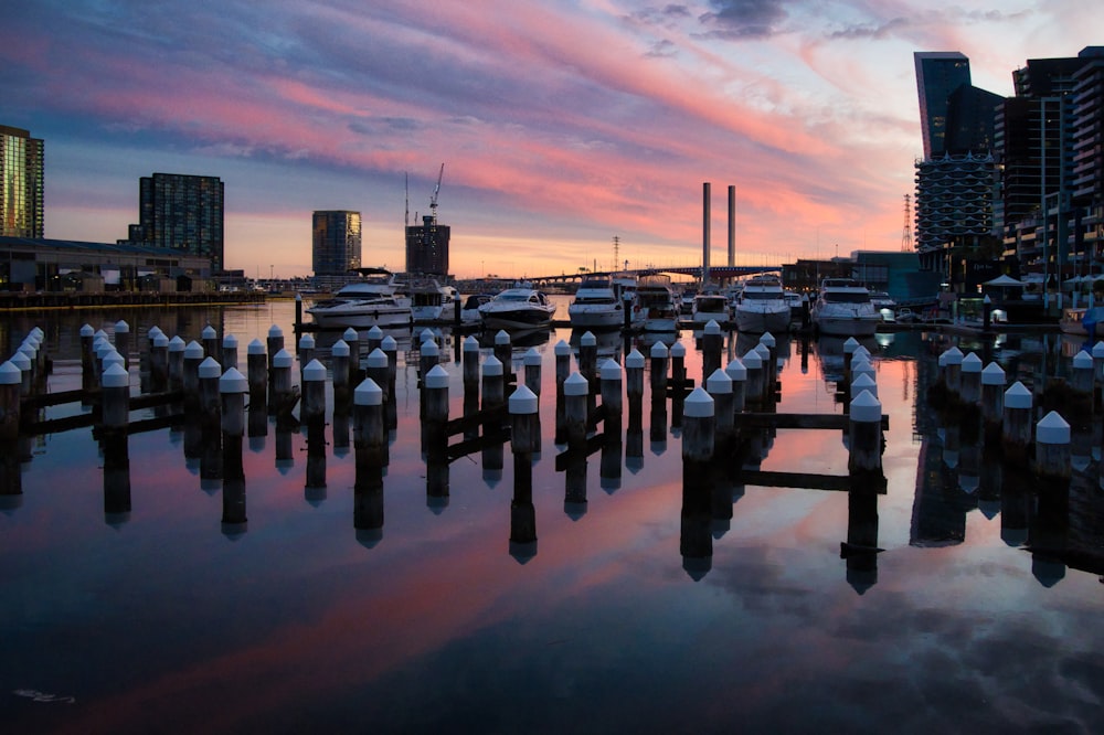 a harbor filled with lots of boats under a cloudy sky