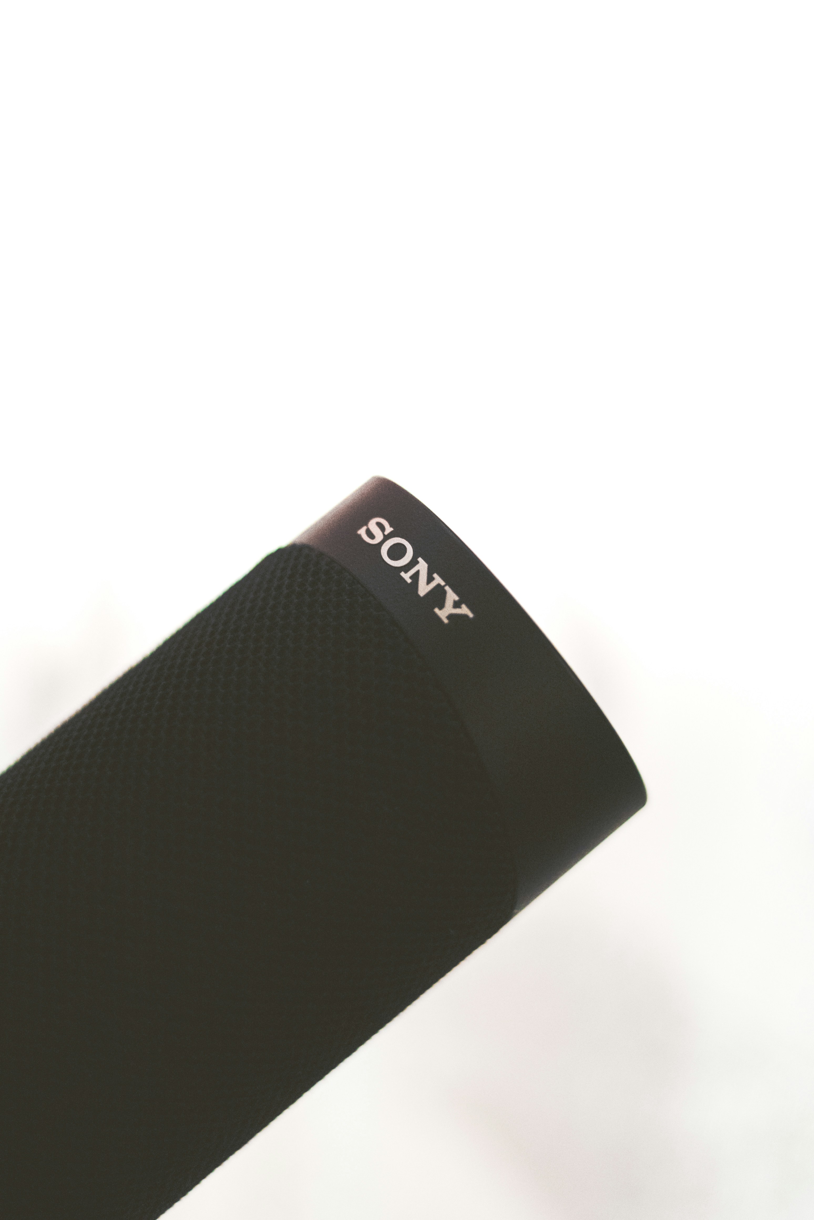 A close up of a cell phone on a white surface