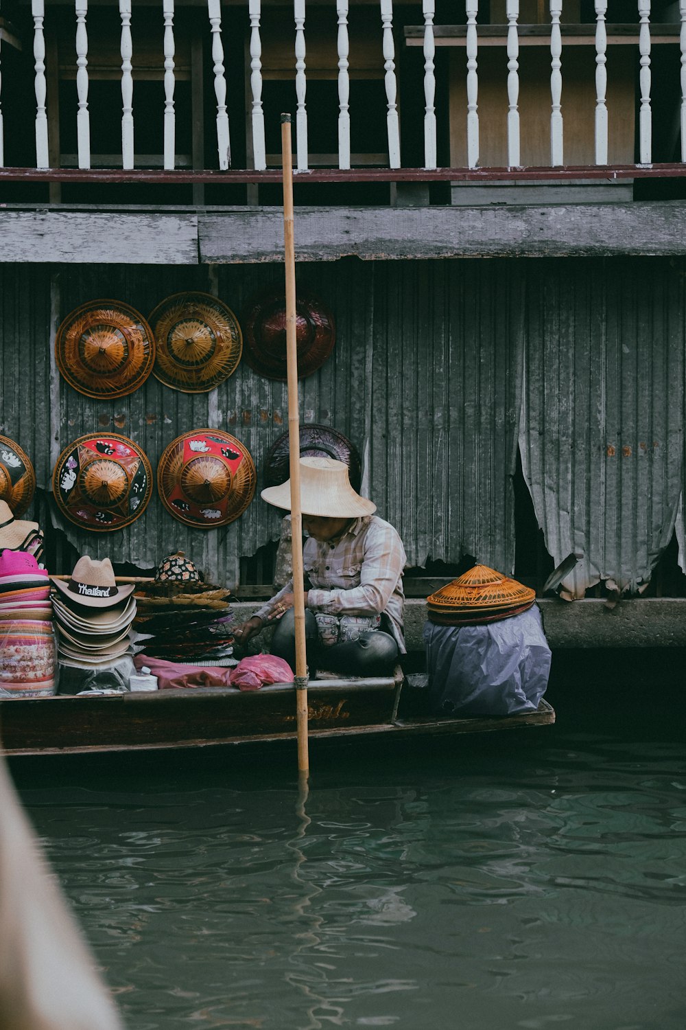 a person sitting on a boat in a body of water