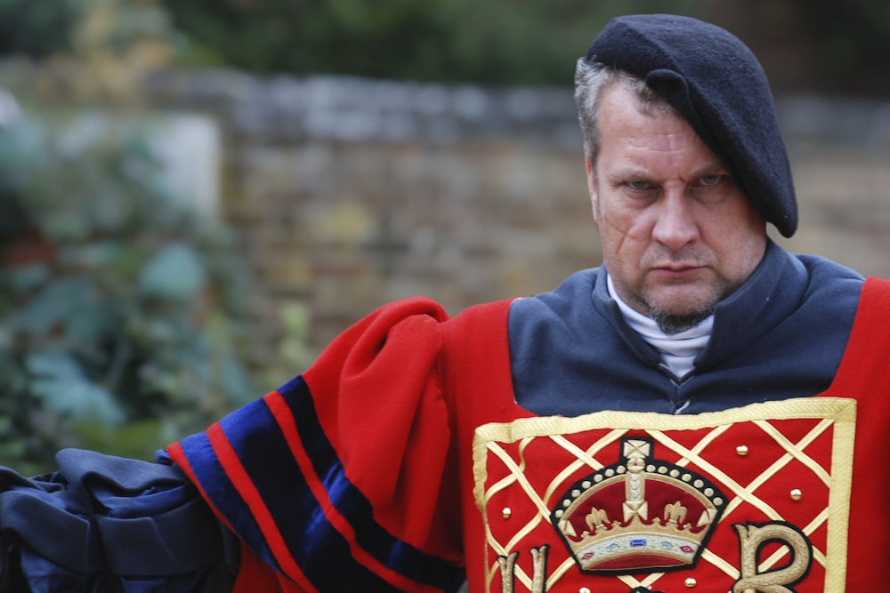 a man dressed in a red and blue outfit