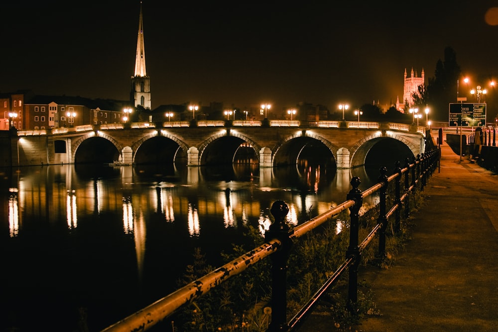 a bridge over a body of water at night