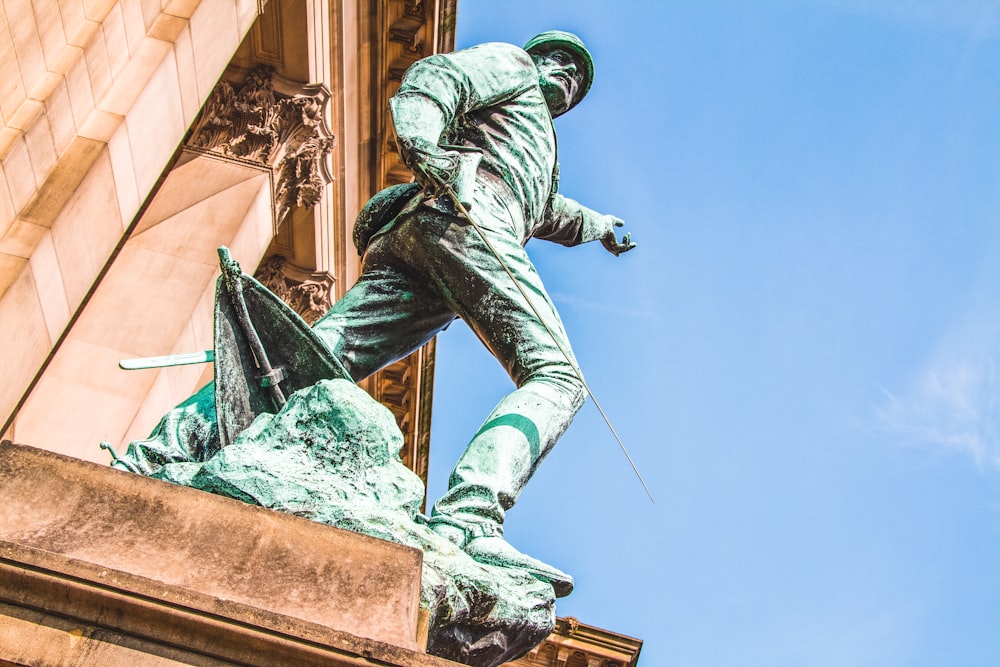 a statue of a man holding a baseball bat