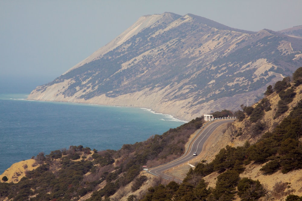 a scenic view of the ocean and mountains