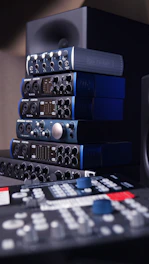 a stack of sound equipment sitting on top of a table