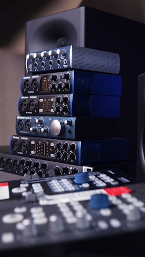 a stack of sound equipment sitting on top of a table