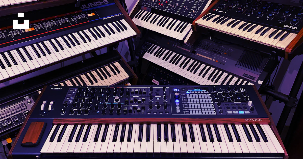 Keyboard Like Instruments A bunch of electronic keyboards sitting next to each other photo – Free ...