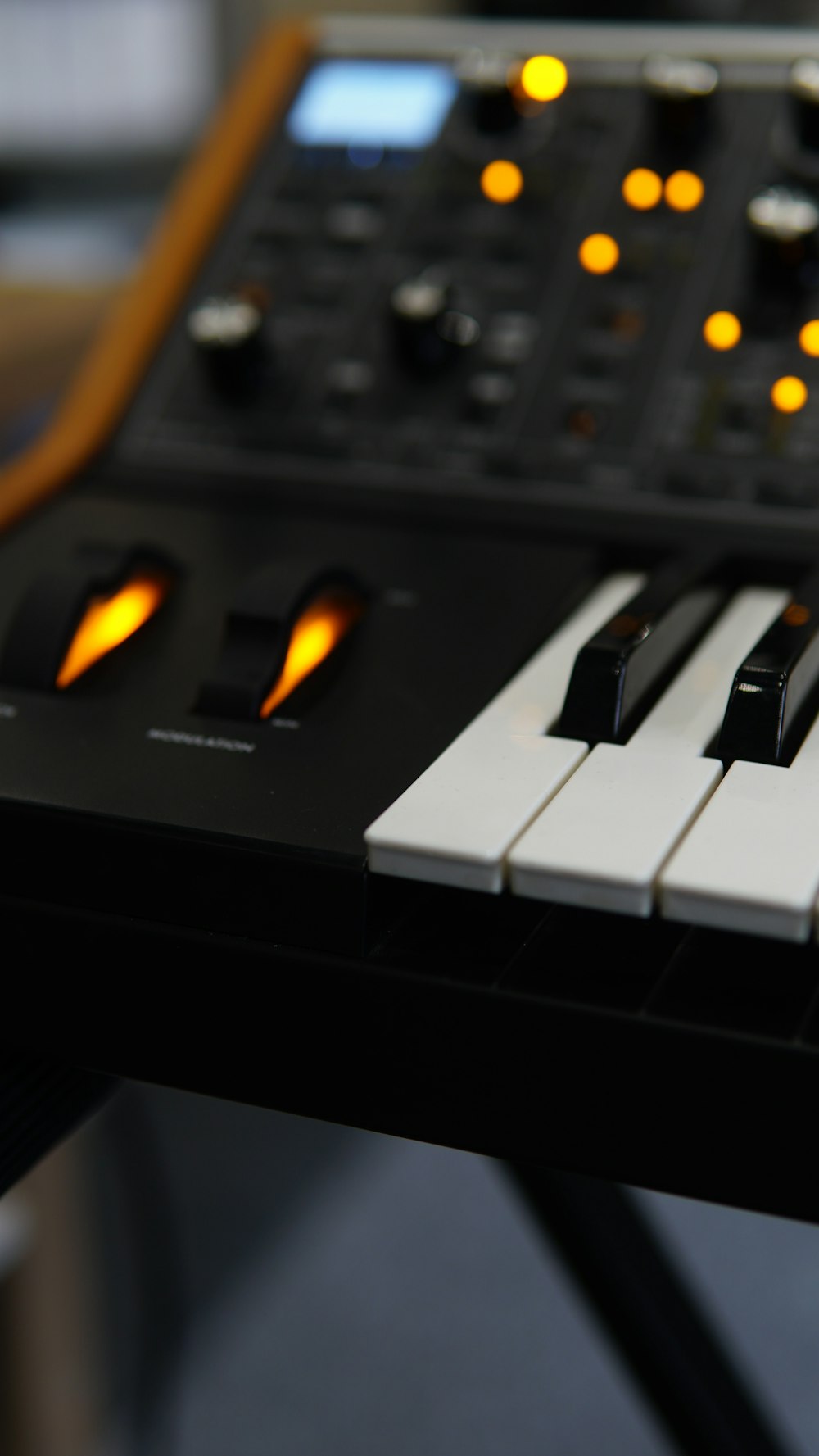 a close up of a keyboard with many knobs