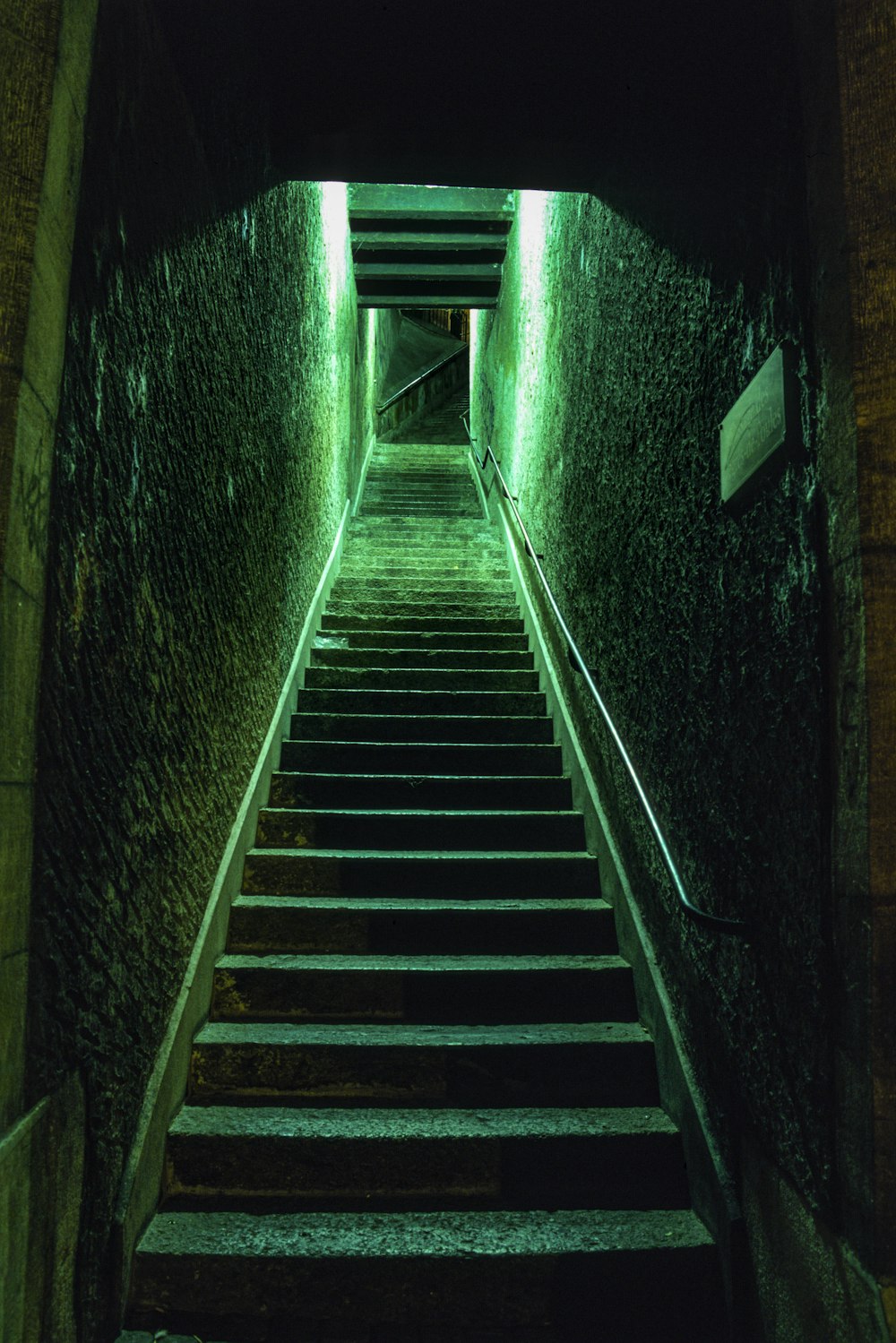 a set of stairs leading up to a tunnel