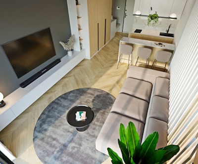 a living room with a couch a table and a tv
