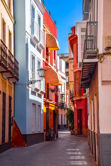 a narrow city street lined with tall buildings