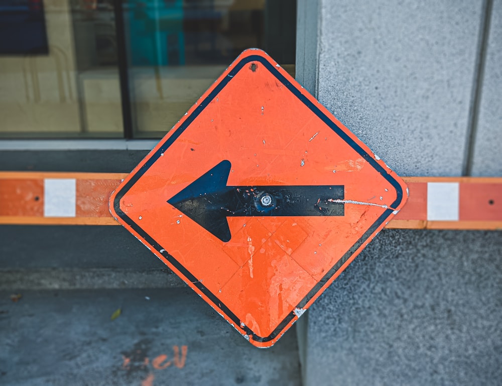 a street sign with an arrow pointing to the right