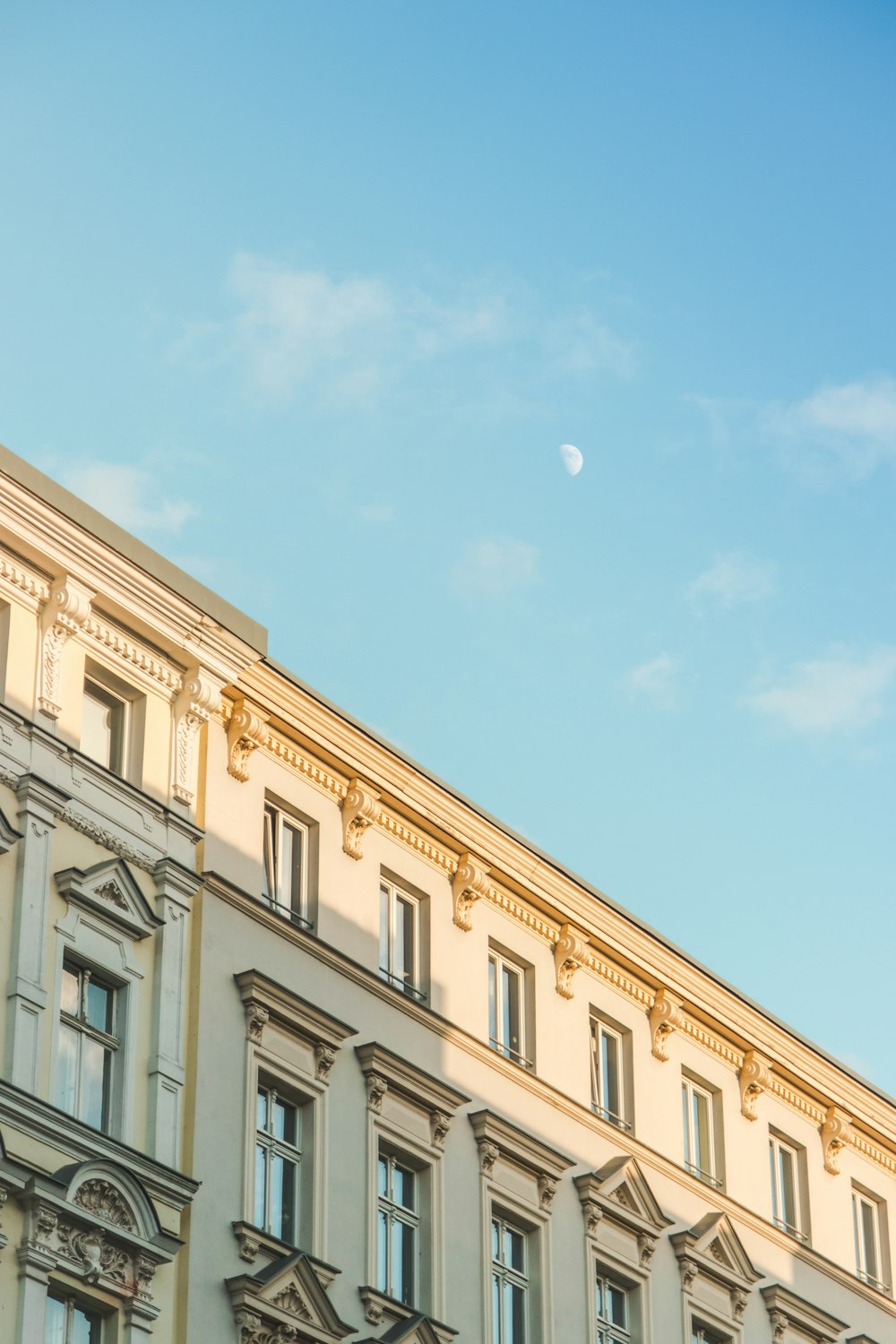 a building with a half moon in the sky