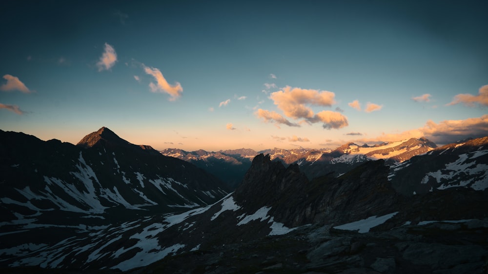 a view of a mountain range at sunset