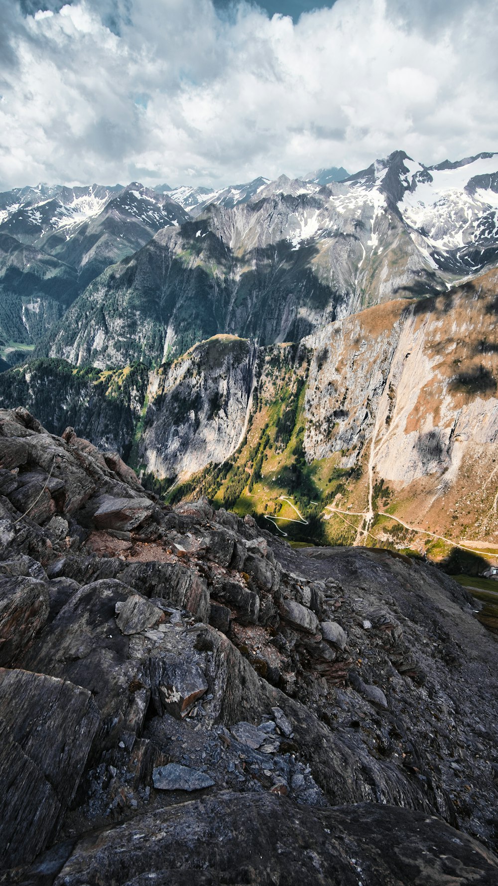 a view of a mountain range from the top of a mountain