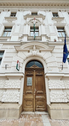 a large white building with a wooden door