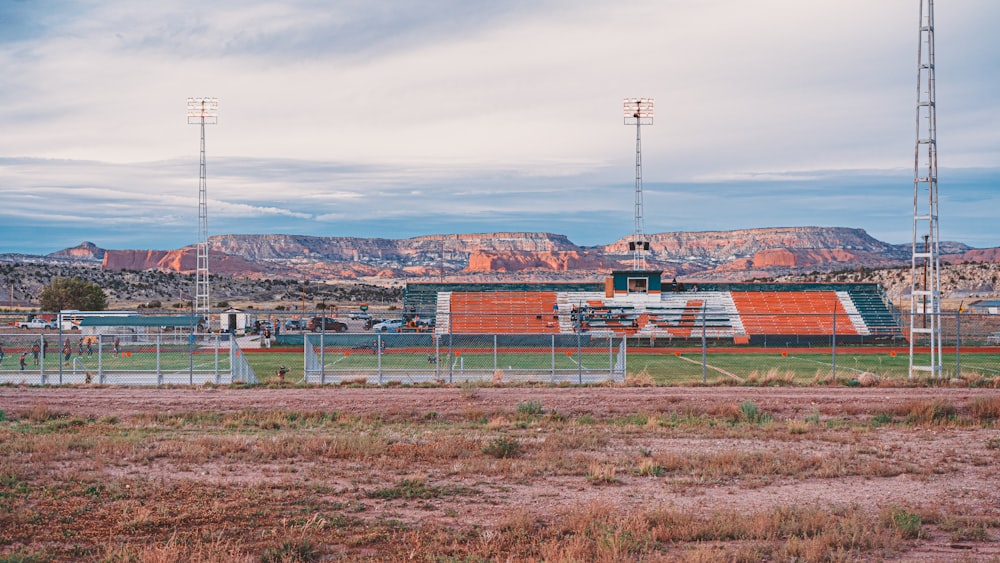 a field with mountains in the background