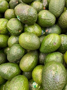 Avocados being packed in a quality-controlled environment.