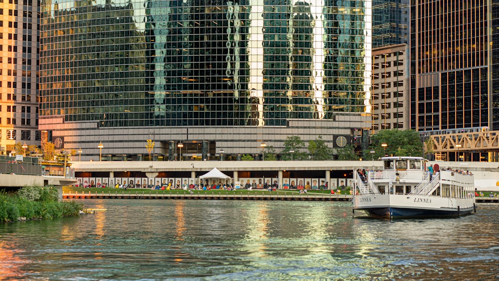 a boat is in the water in front of a city