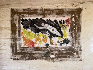 A close-up of abstract wildlife in a gold frame.