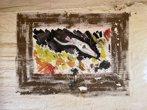 A close-up of abstract wildlife in a gold frame.