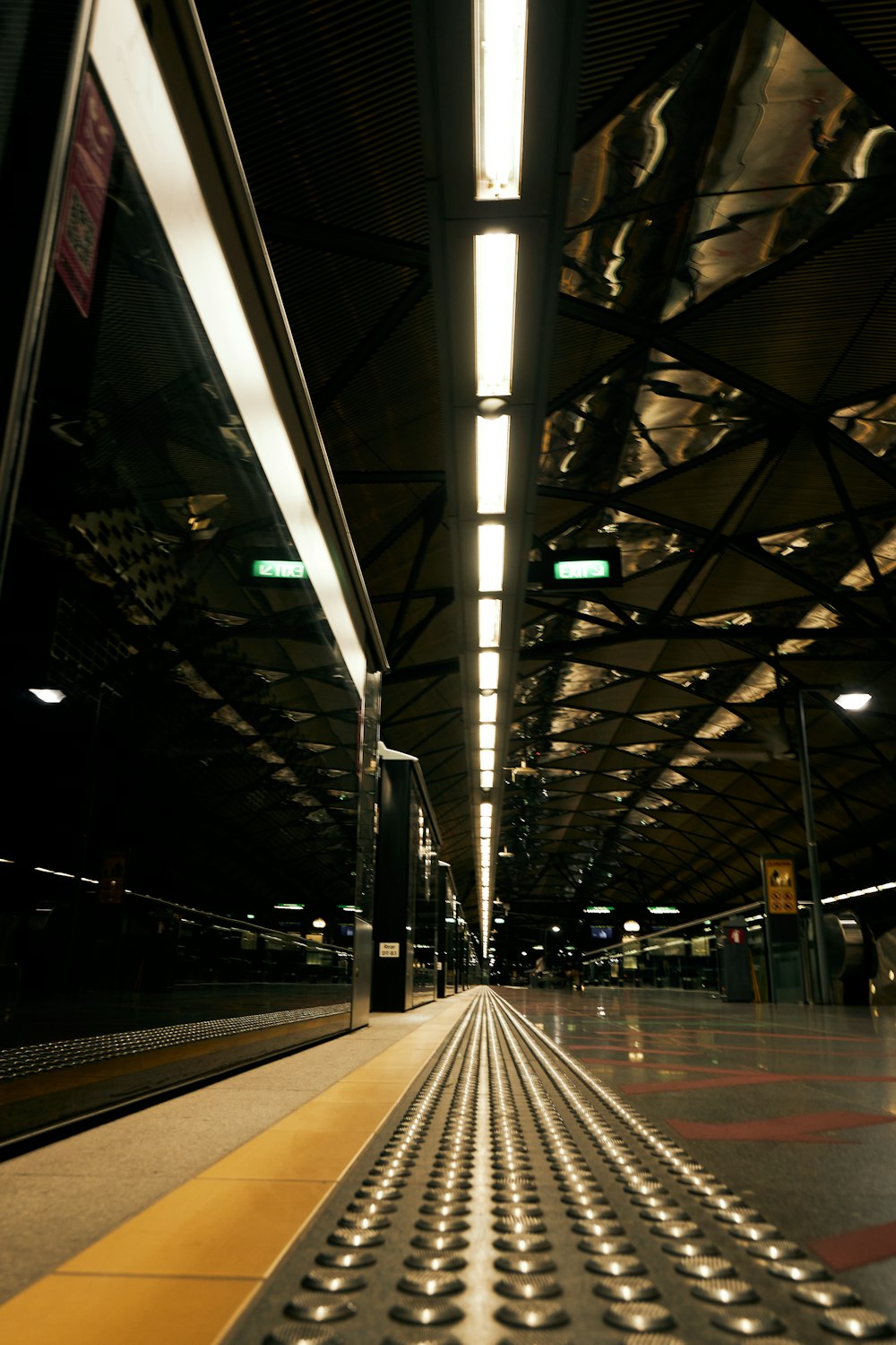 a train station with a train on the tracks