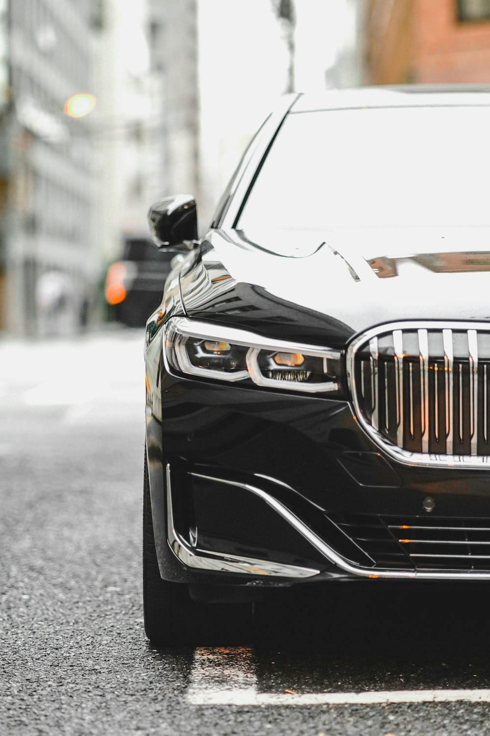 a black car parked on the side of the road