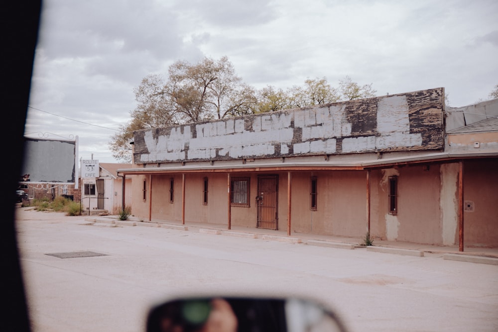 a person taking a picture of an abandoned building