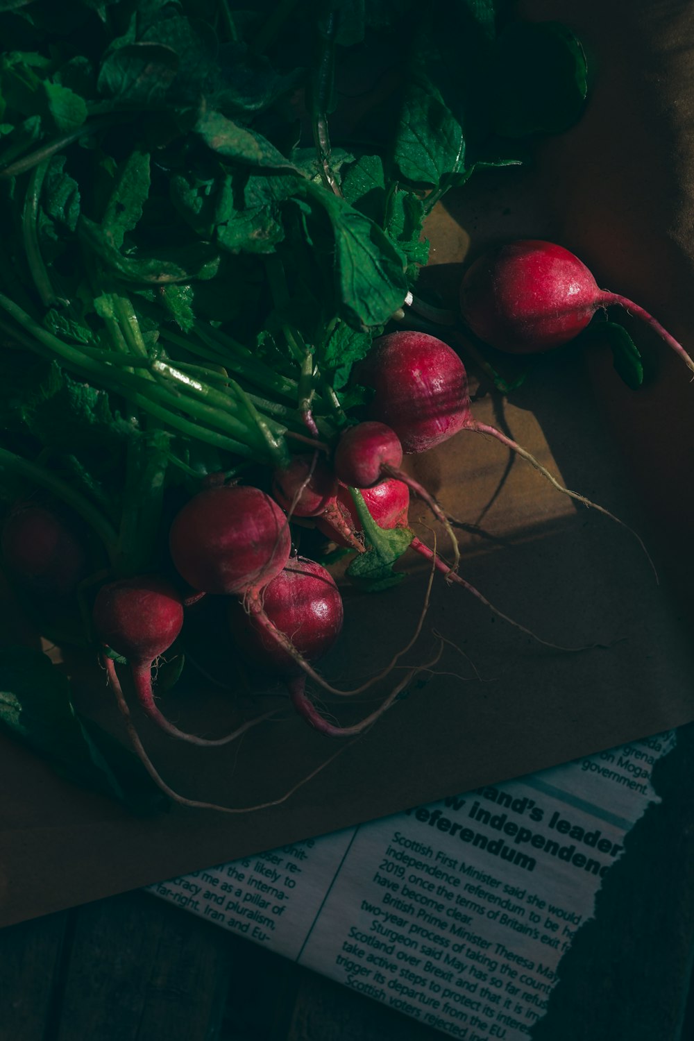 a bunch of radishes sitting on top of a cutting board