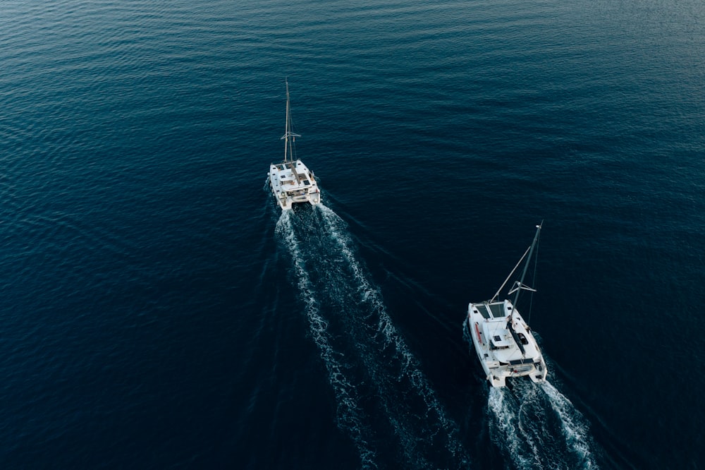 two boats in the middle of the ocean