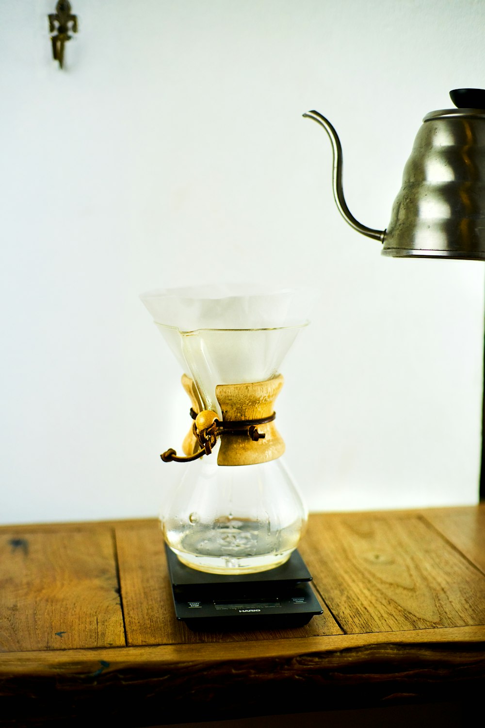 a table with a coffee pot on top of it