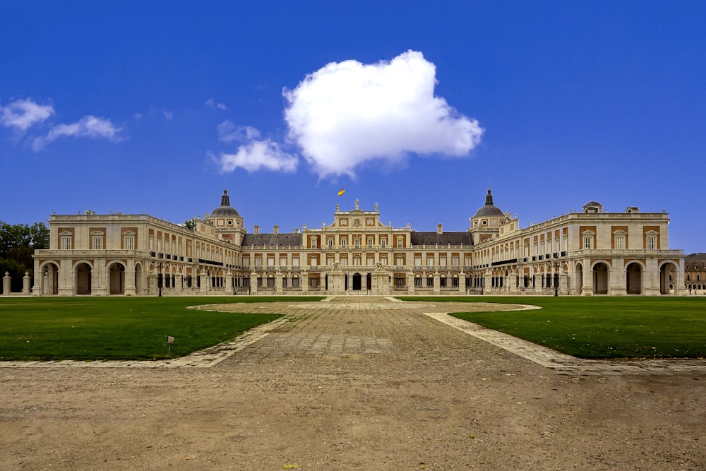 a large building with a long driveway in front of it