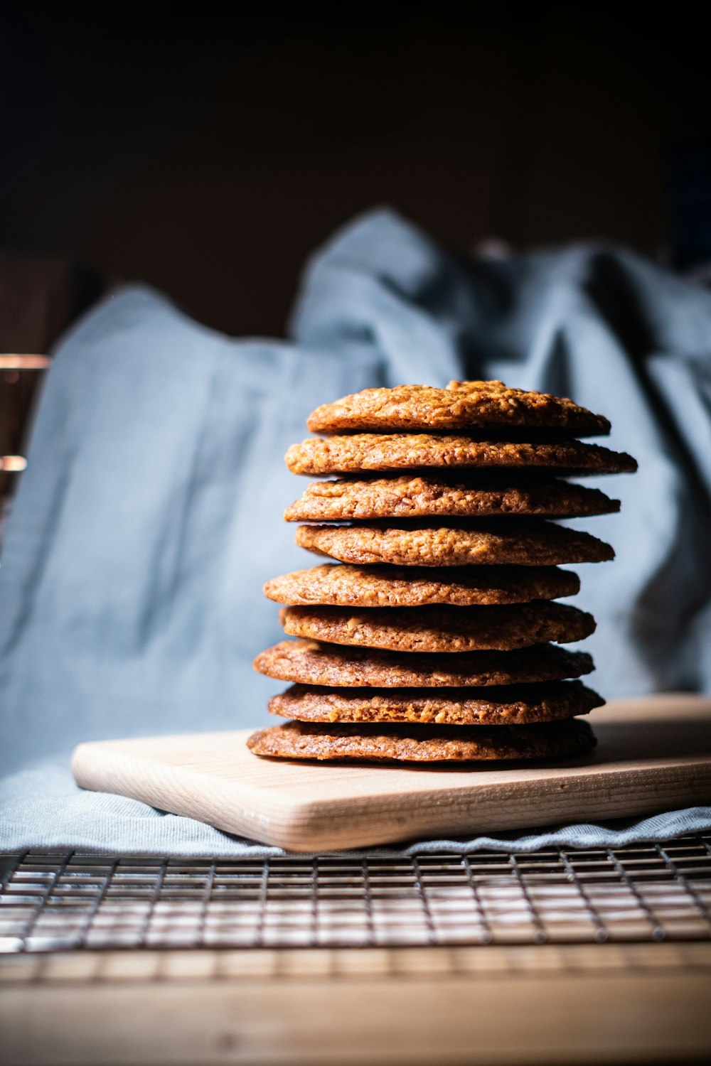 a stack of cookies sitting on top of a wooden board