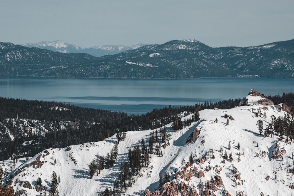 a view of a mountain with a lake in the distance