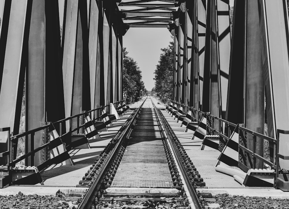 a black and white photo of a train track