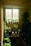 A serene office space with plants and natural light promoting a calm atmosphere.
