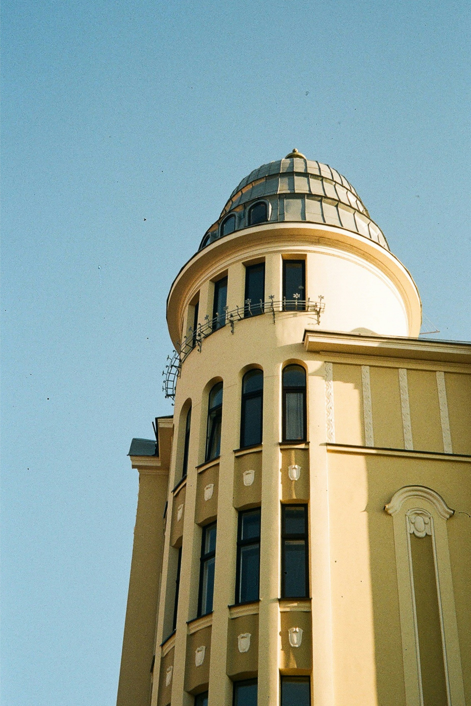 a tall building with a clock on the top of it