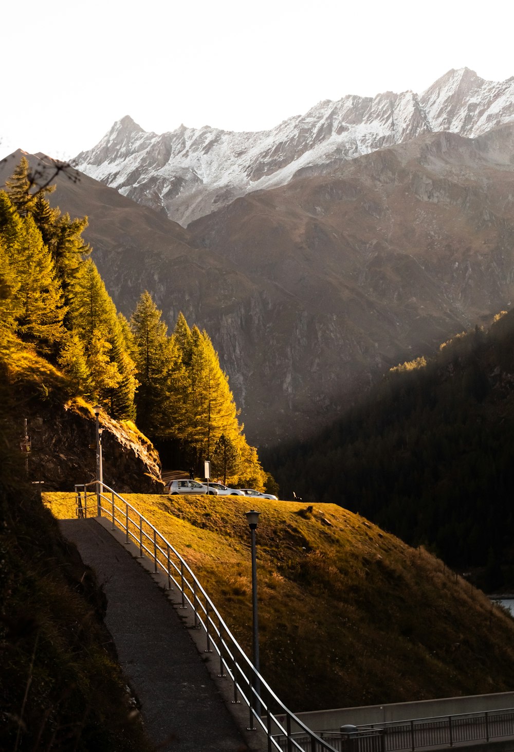 a scenic view of mountains and a road