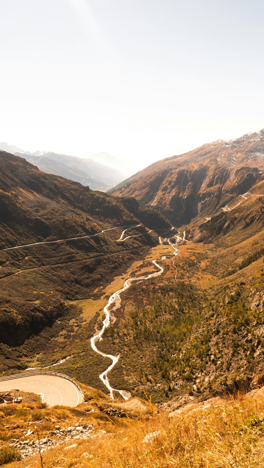 a view of a winding road in the mountains