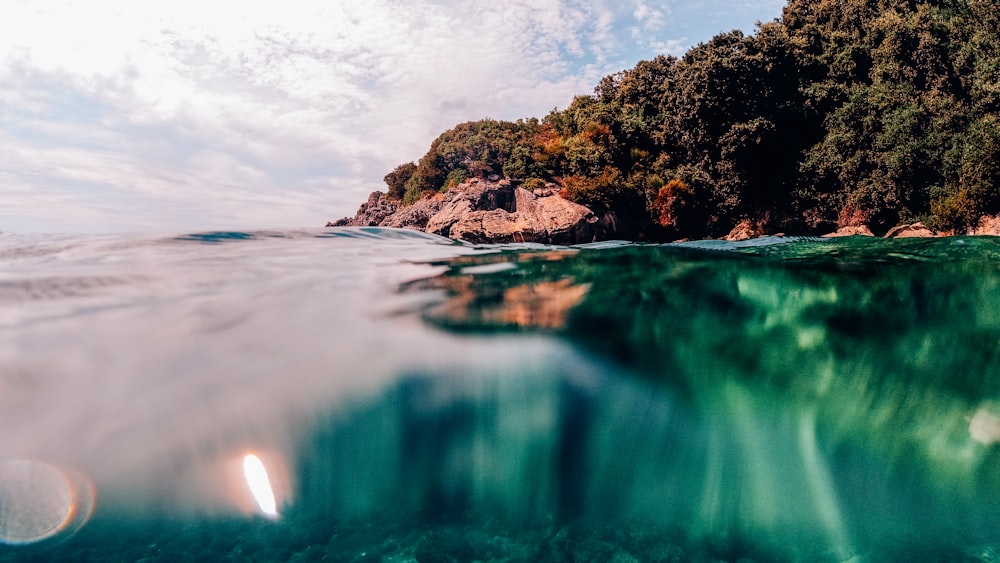 a body of water with a small island in the background