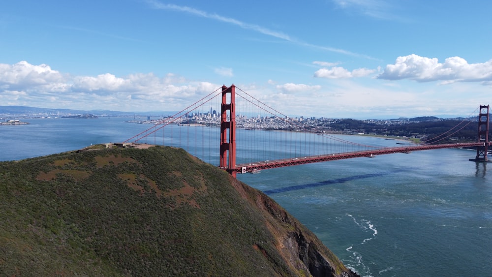 a view of the golden gate bridge from the top of a hill