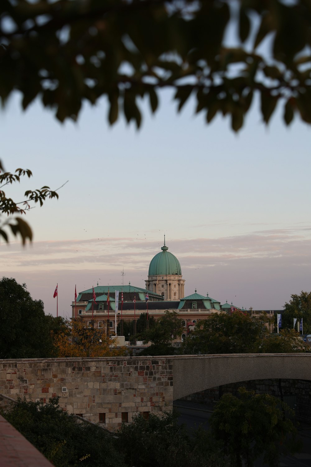 a large building with a green dome on top of it