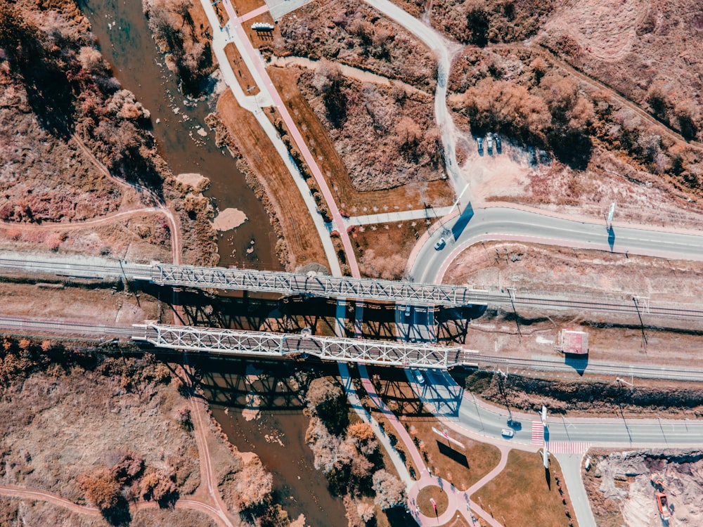 an aerial view of a bridge over a river