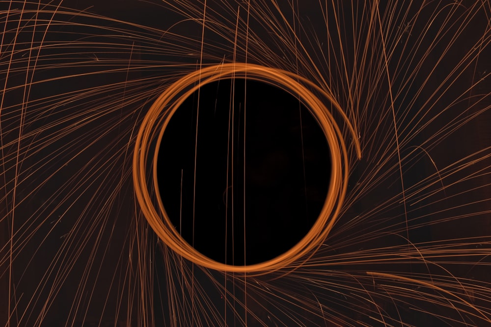 a circular object is shown in the middle of a dark background