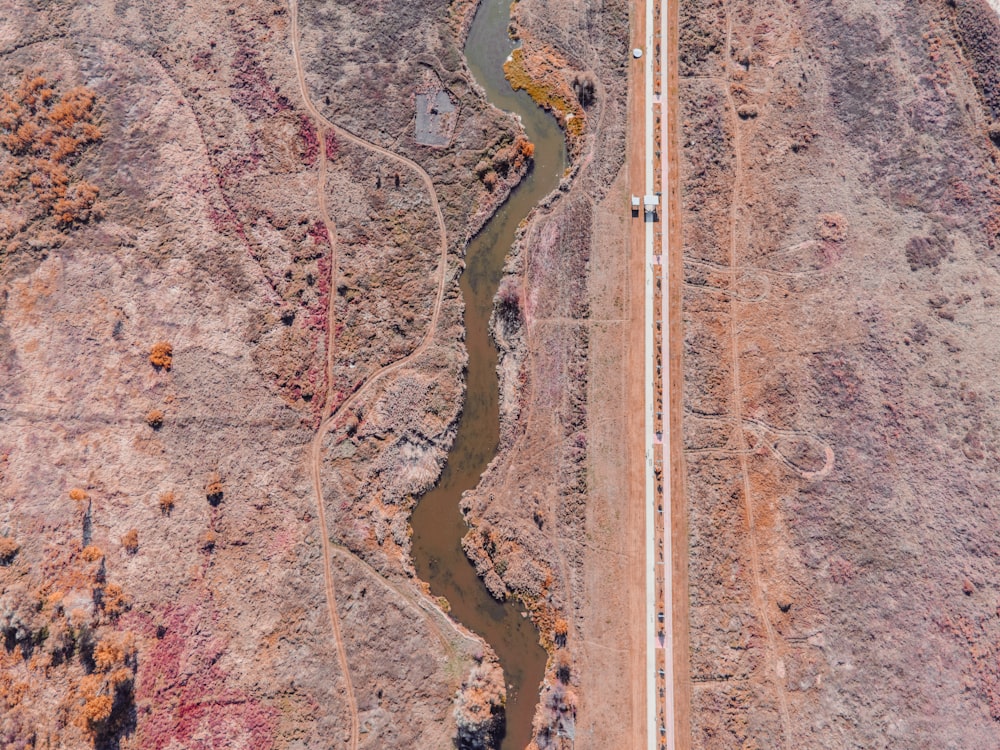 an aerial view of a road in the desert