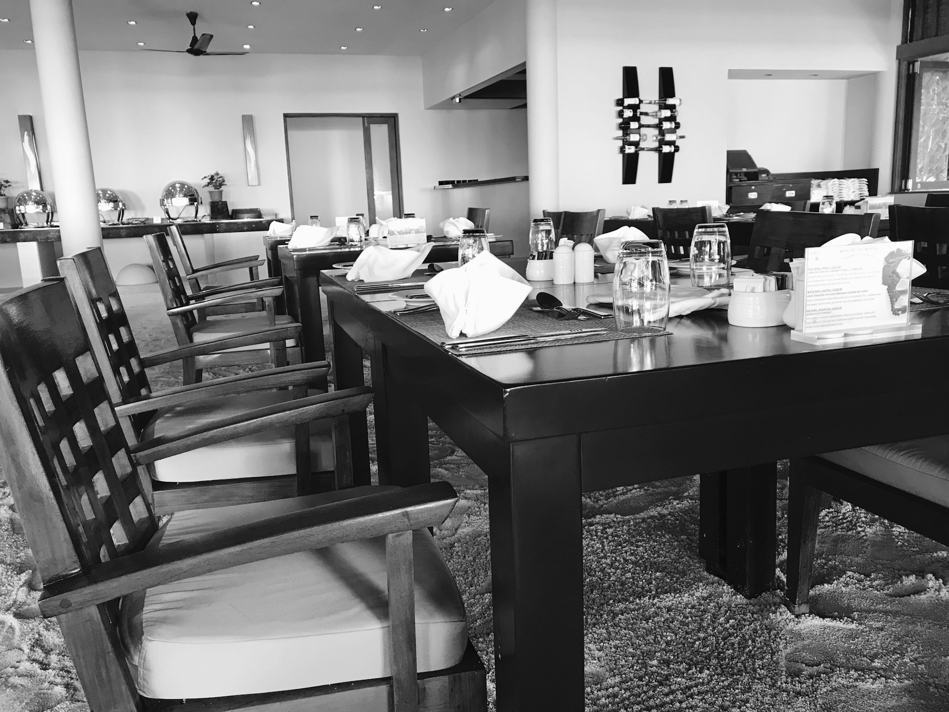 Pristine restaurant dining area in Oahu, tables set and floors spotless, ready for guests.