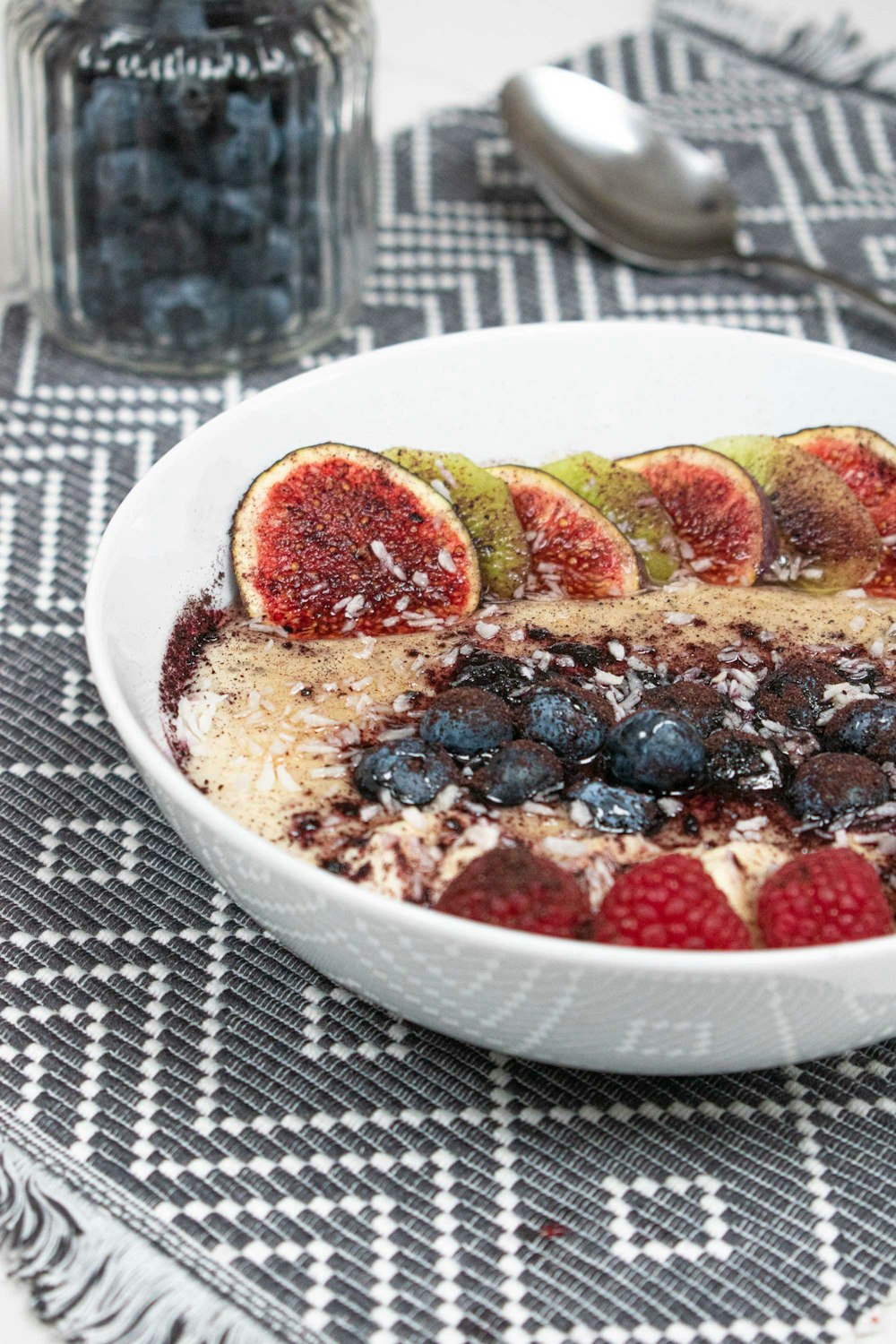 a bowl of food with fruit on top of it