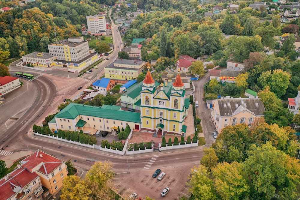 an aerial view of a small town with a church