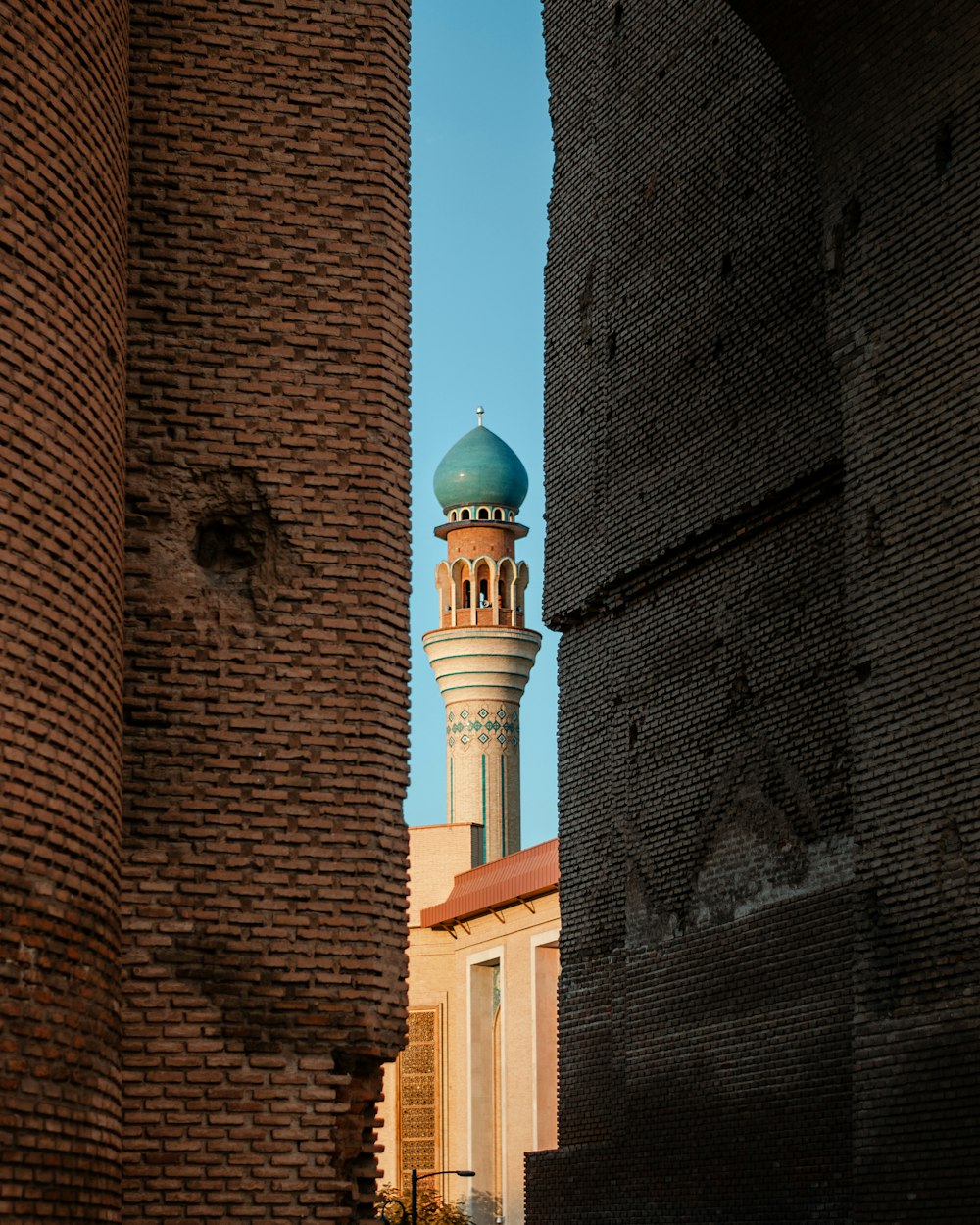 a tall building with a blue dome on top of it