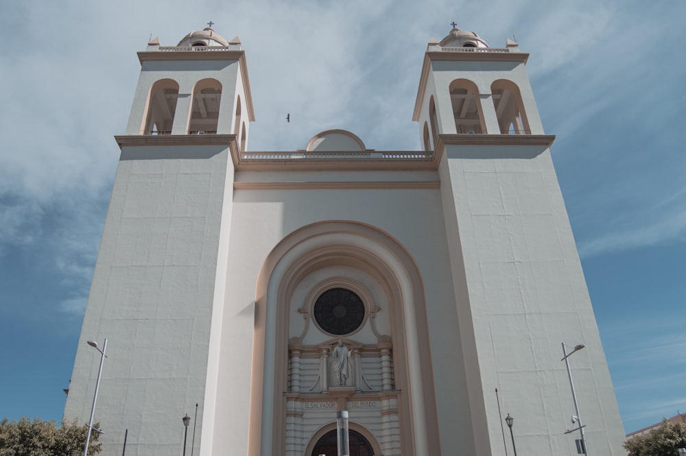 a large white church with a clock on the front