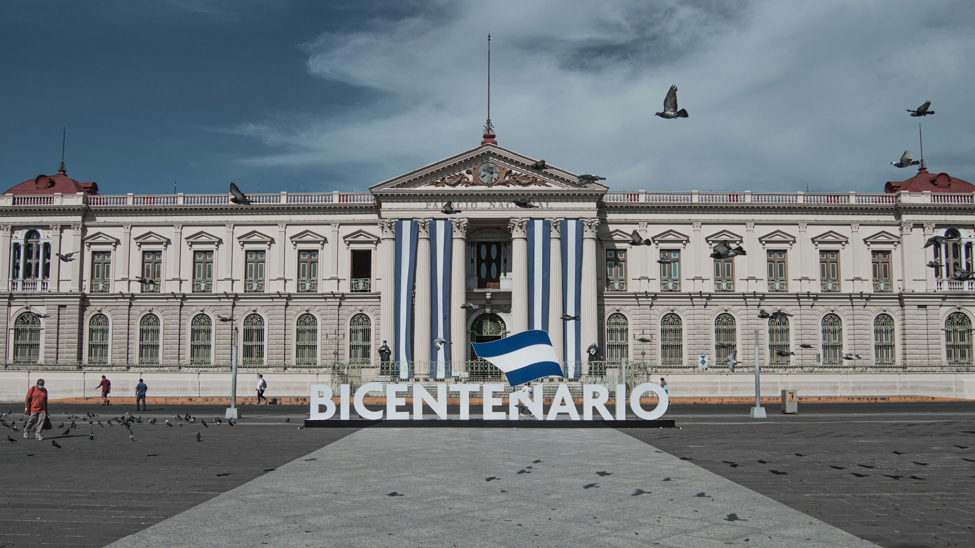 a large building with a flag in front of it